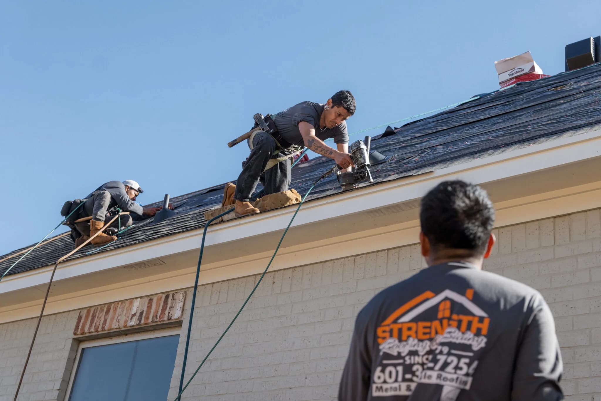 Completed architectural shingle roof by Strength Roofing & Siding
