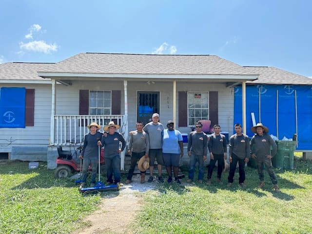 Strength team on a community service roofing project